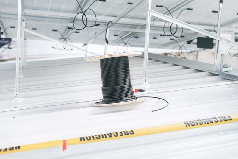 A coil of cable, of the kind wrapped along a pipe run to stop it freezing - a stand-in for the Frost King Pre-Slit Tubular Polyethylene Foam Pipe Insulation, not a photograph of this model