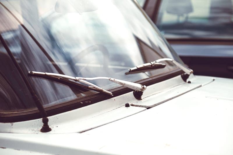 A windshield wiper blade against frosted glass - a stand-in for the Rain-X Latitude with Water Repellency, not a photograph of this model
